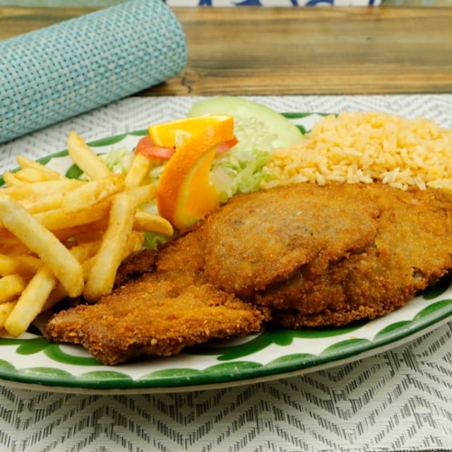 17. Milanesa con Papas / 17. Breaded Rib Eye with Fries.